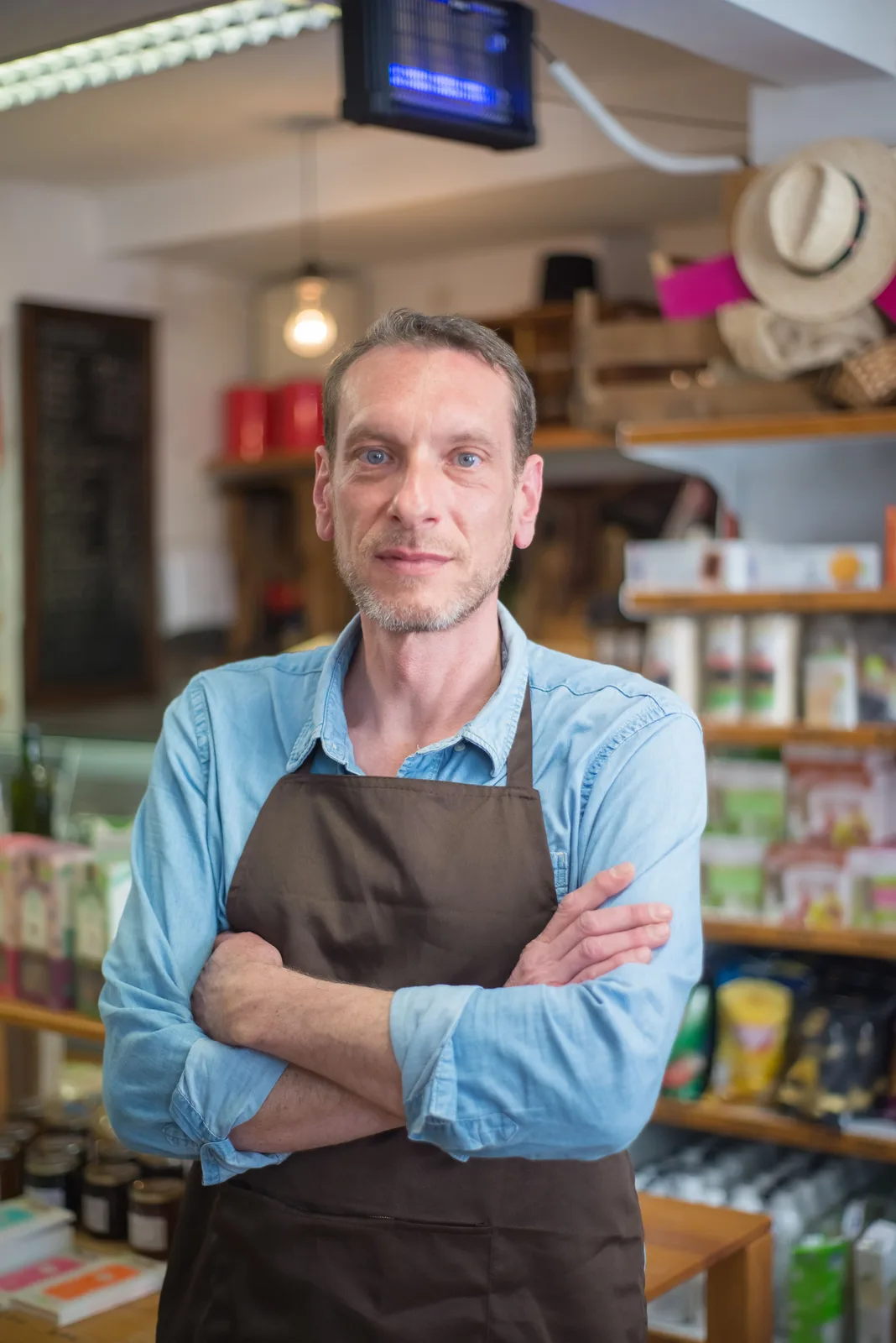 Business owner working in a bright shop